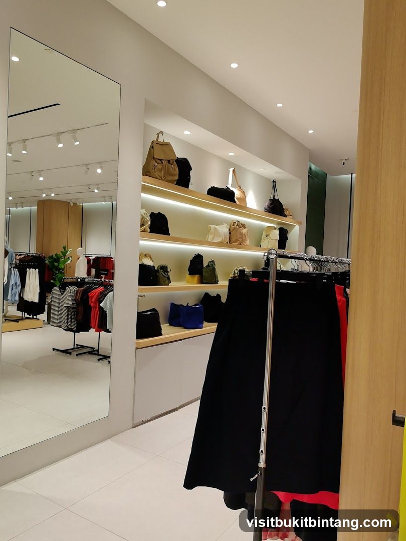 Clothing store interior with handbags and apparel