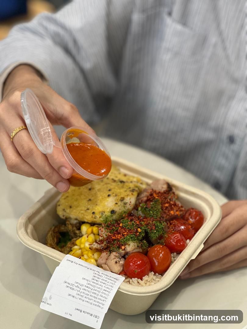 Person adding sauce to a bowl