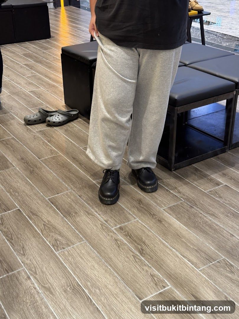 Person wearing Dr. Martens shoes
