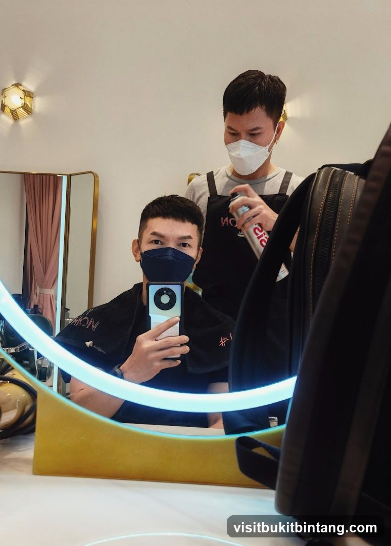 Hairdresser spraying hairspray on client