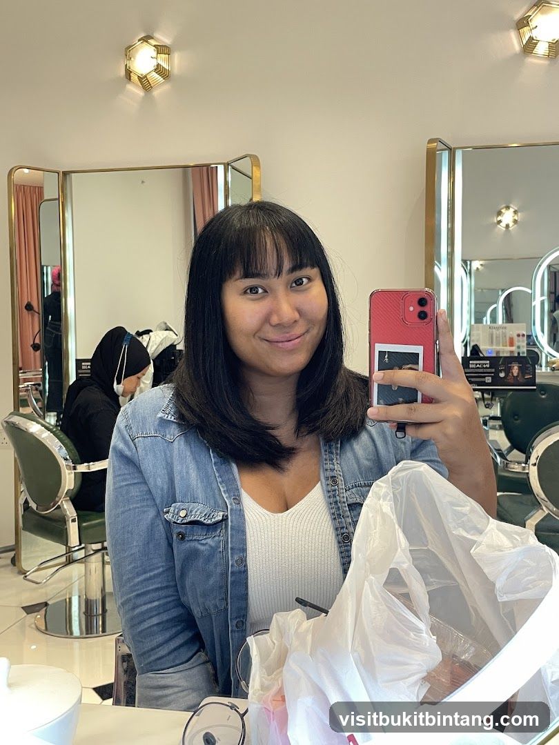 Woman taking a selfie in a salon