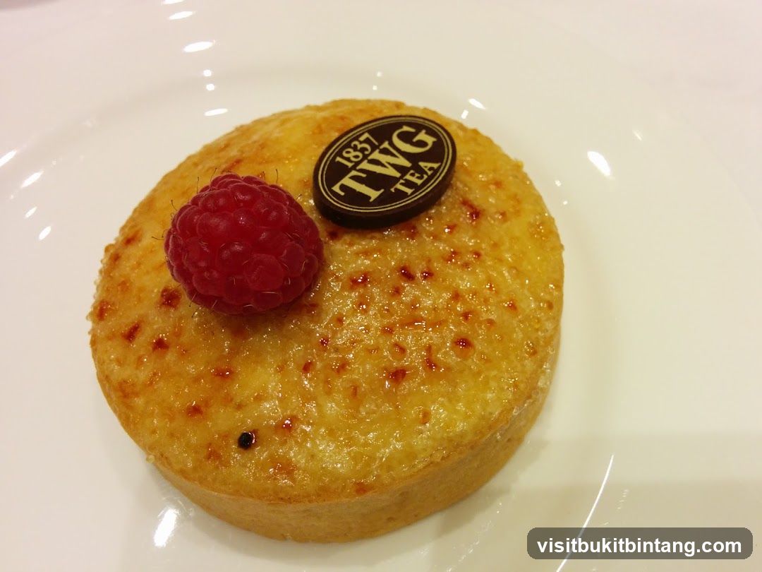 Dessert with Raspberry and TWG Tea Logo