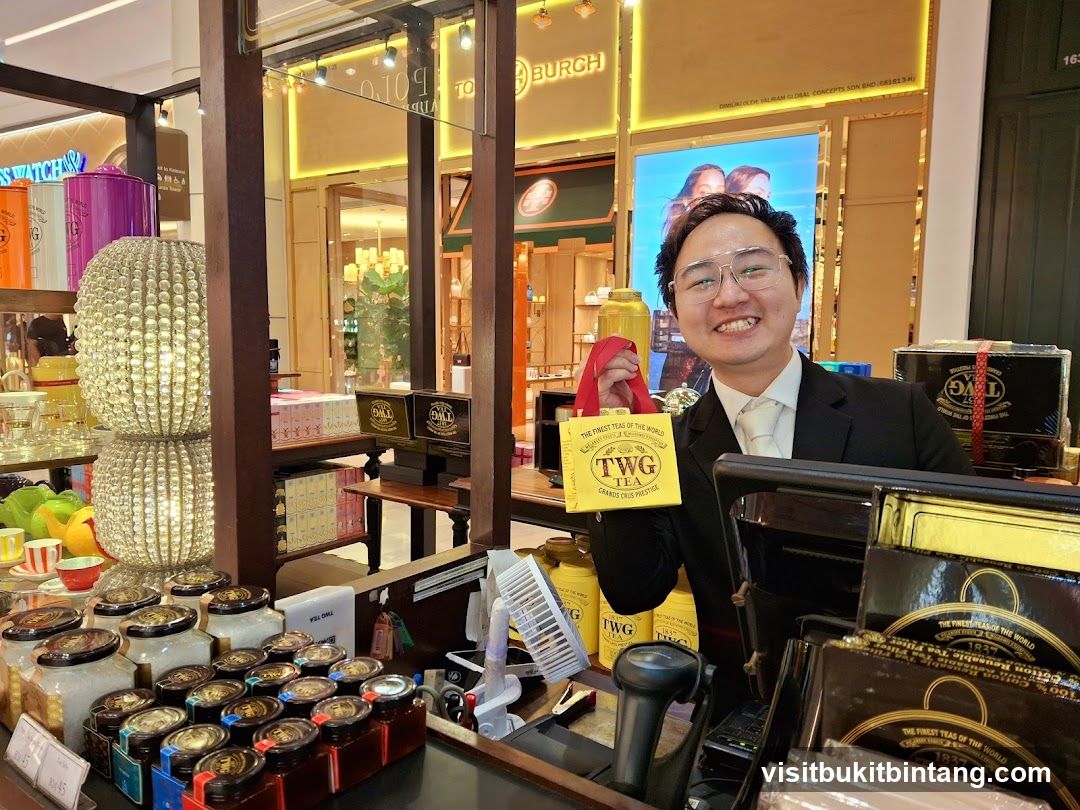 Man holding TWG Tea gift bag