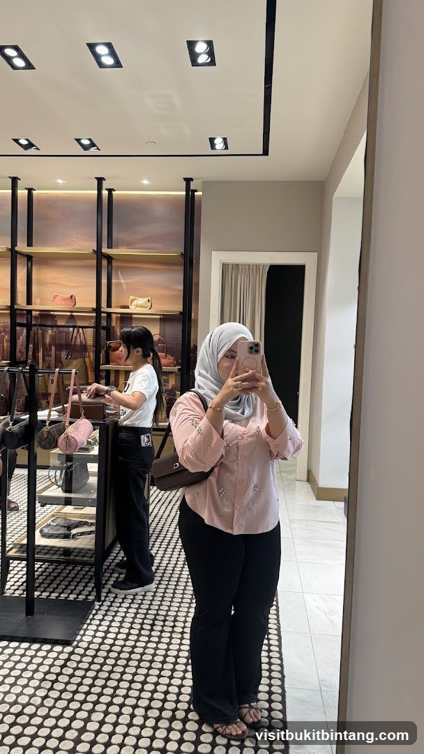 Woman taking a mirror selfie in a handbag store
