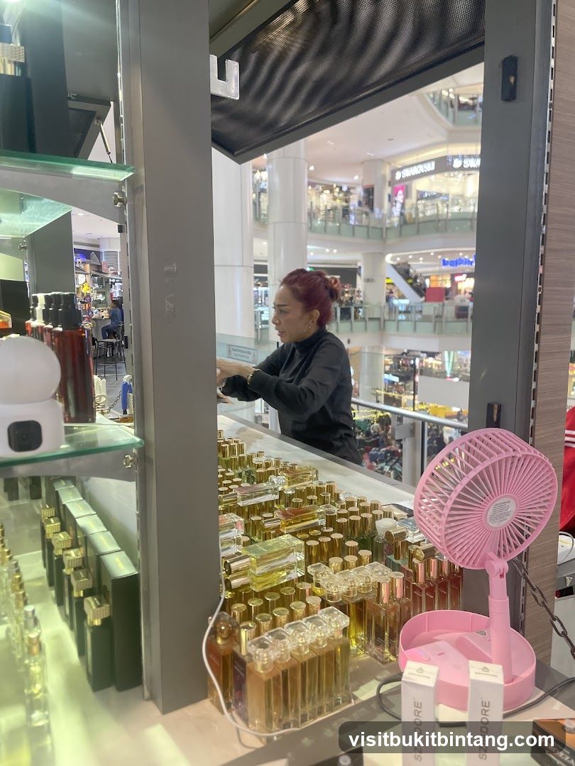Perfume display with staff in background