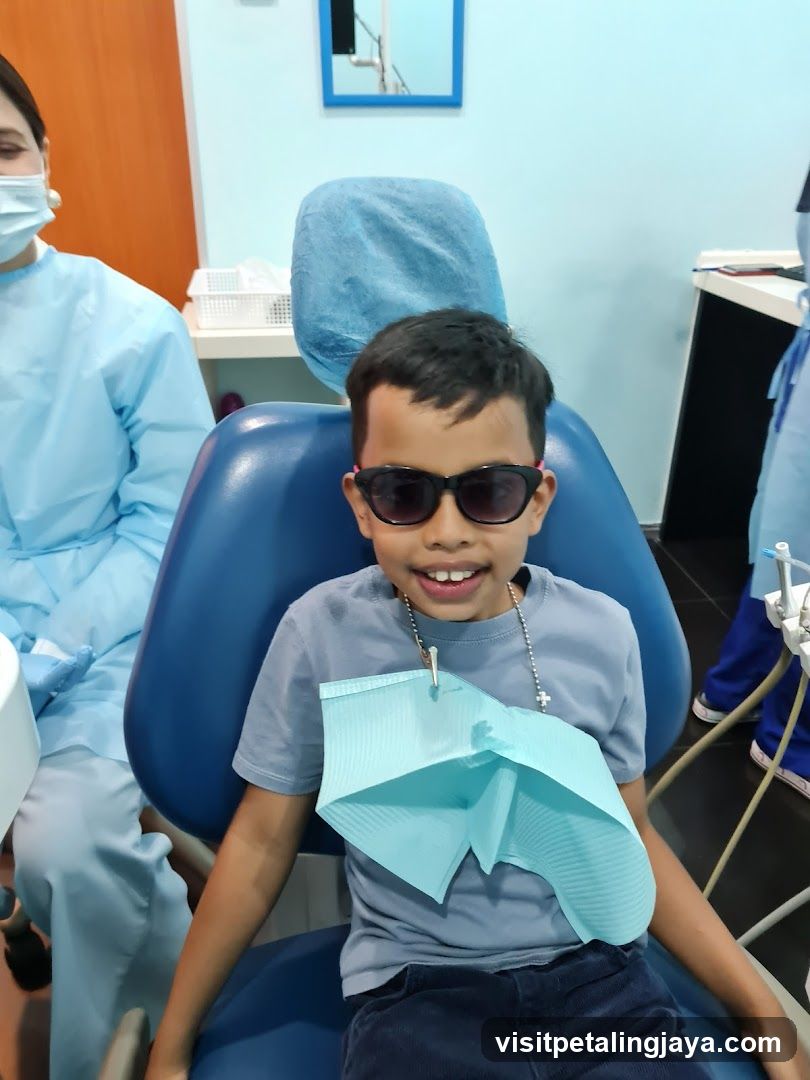 Child in Dental Chair with Sunglasses