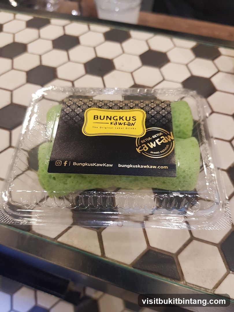 Green dessert rolls in a plastic container