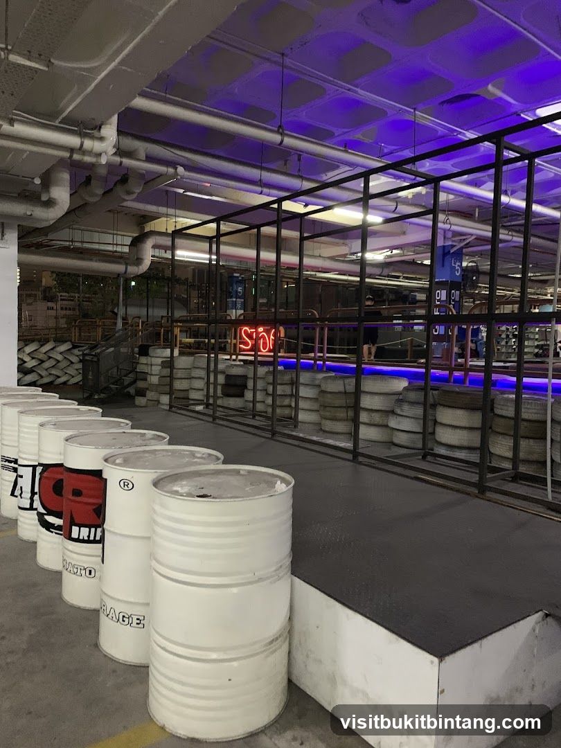 Indoor racing venue with barrels and tires