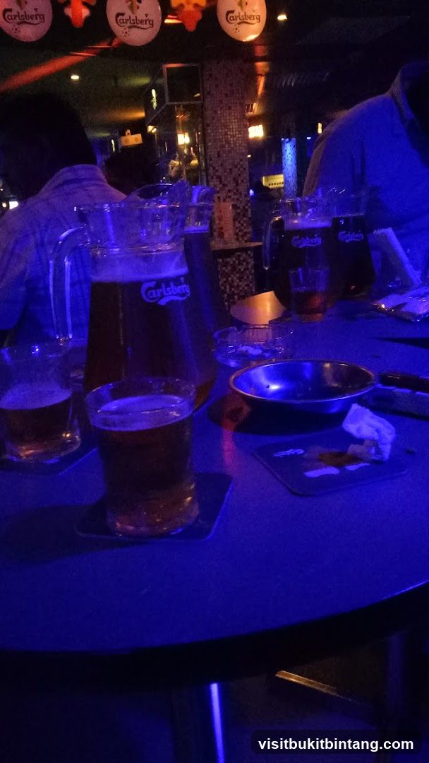 Bar scene with beer pitchers and glasses