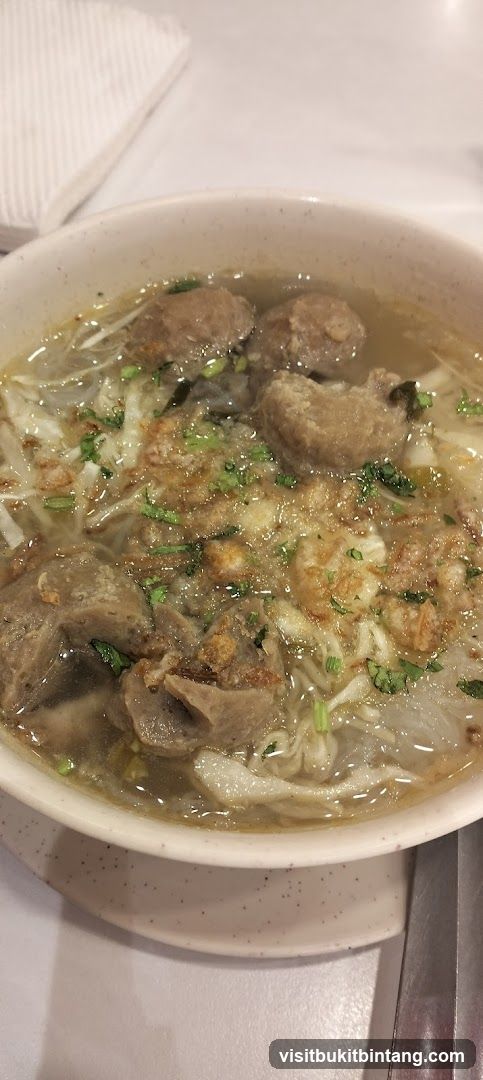 Bowl of Noodle Soup with Meatballs