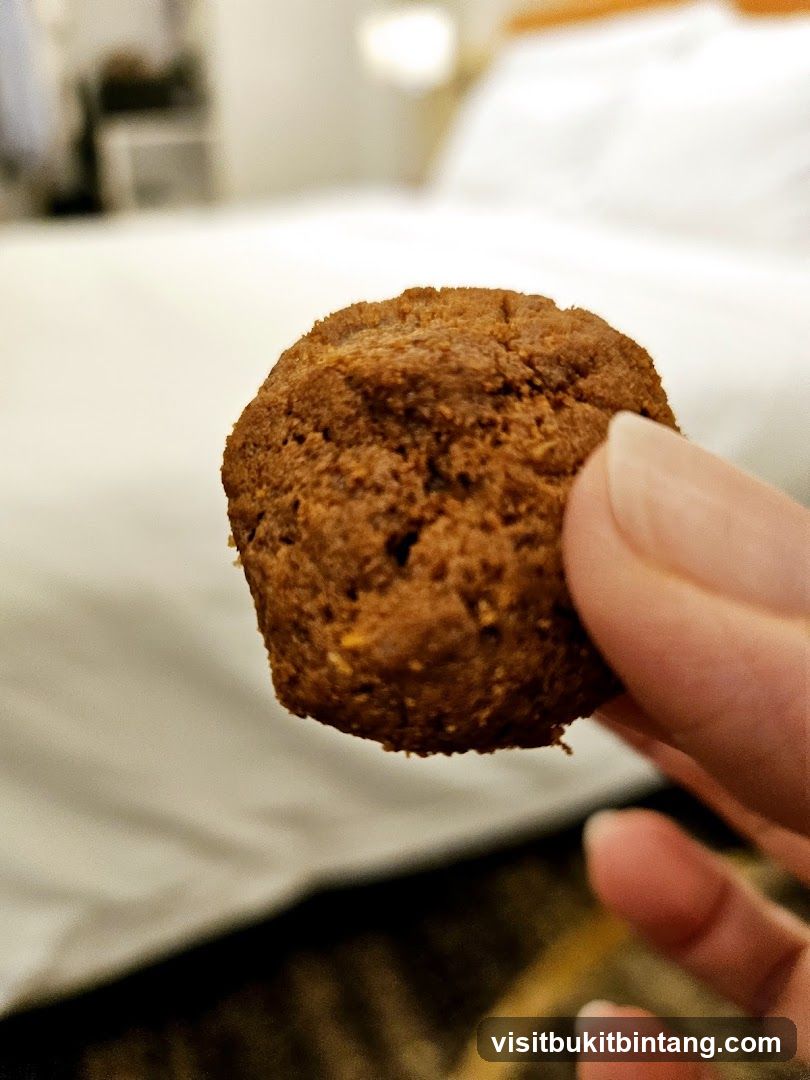 Cookie held by fingers