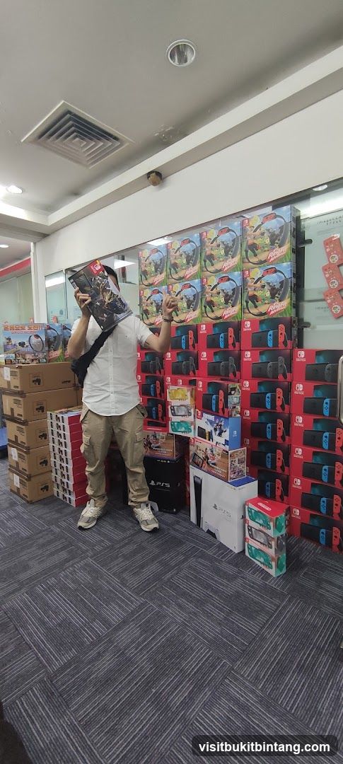 Man holding a game box in a store