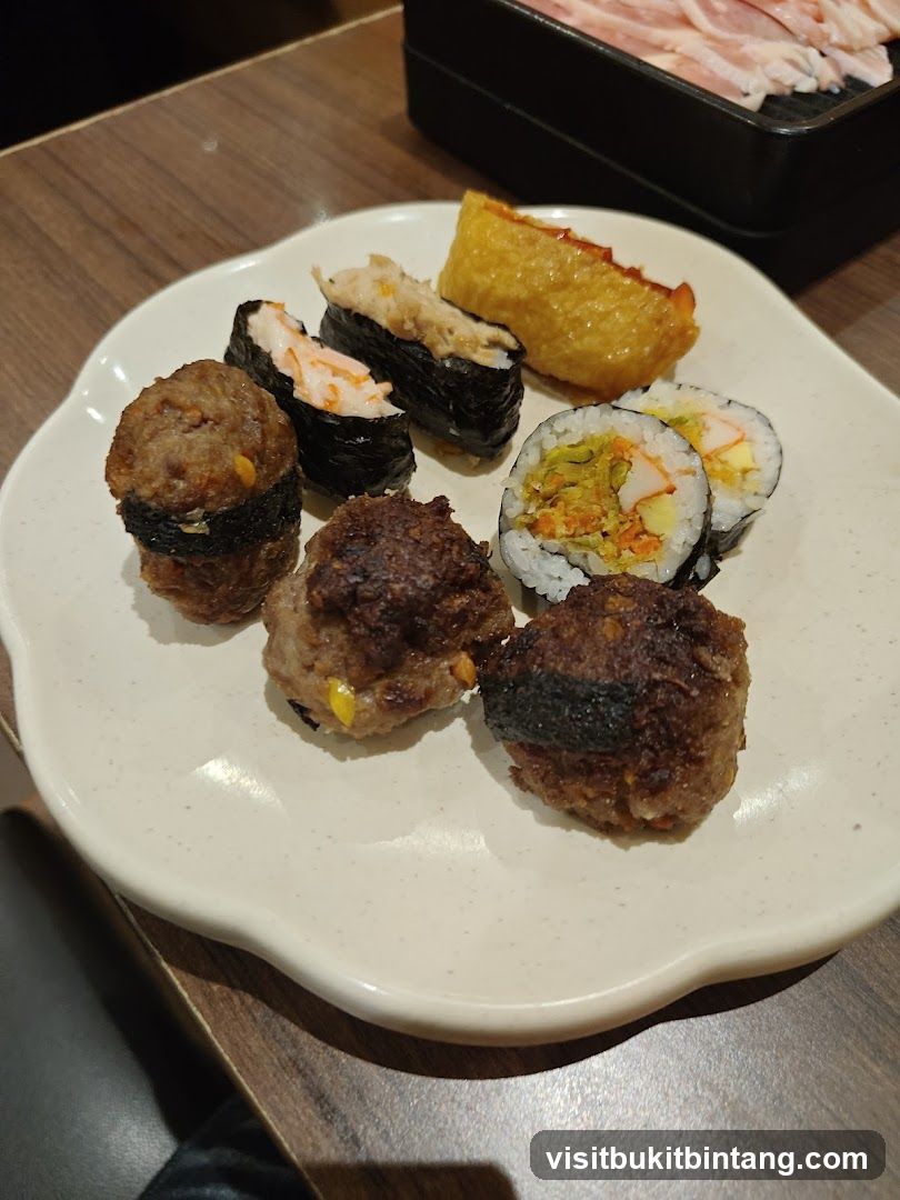 Plate of Sushi and Meatballs