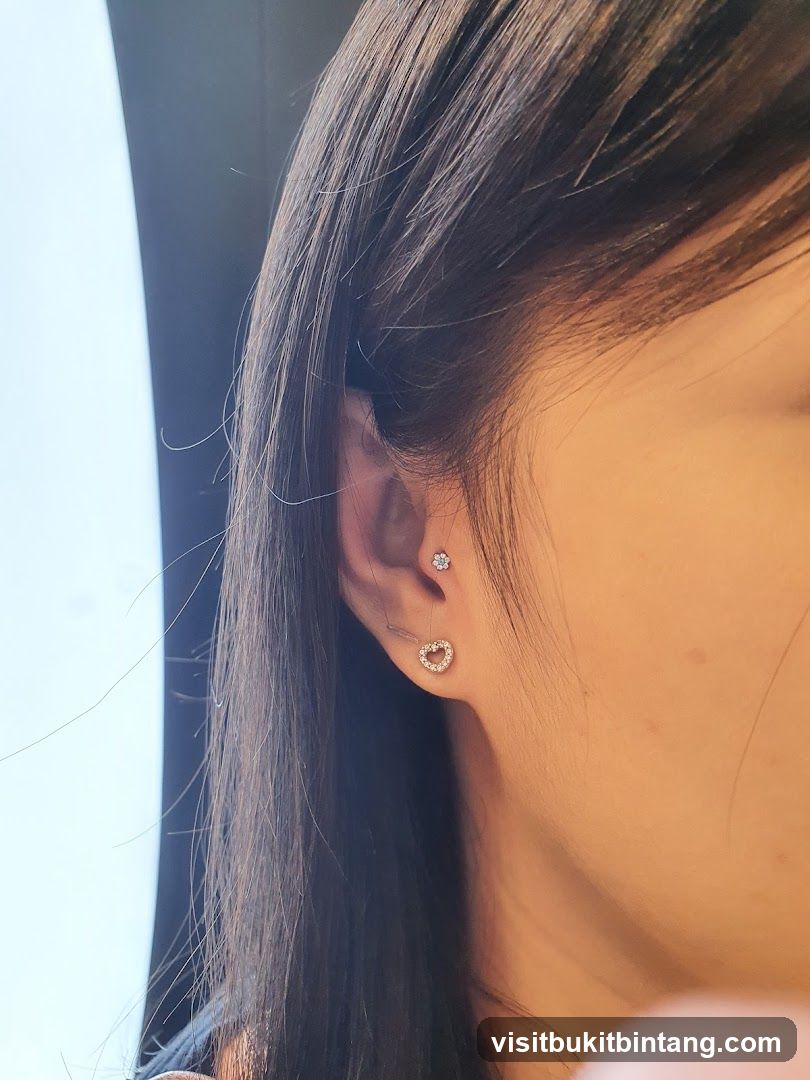 Close-up of a woman's ear with piercings
