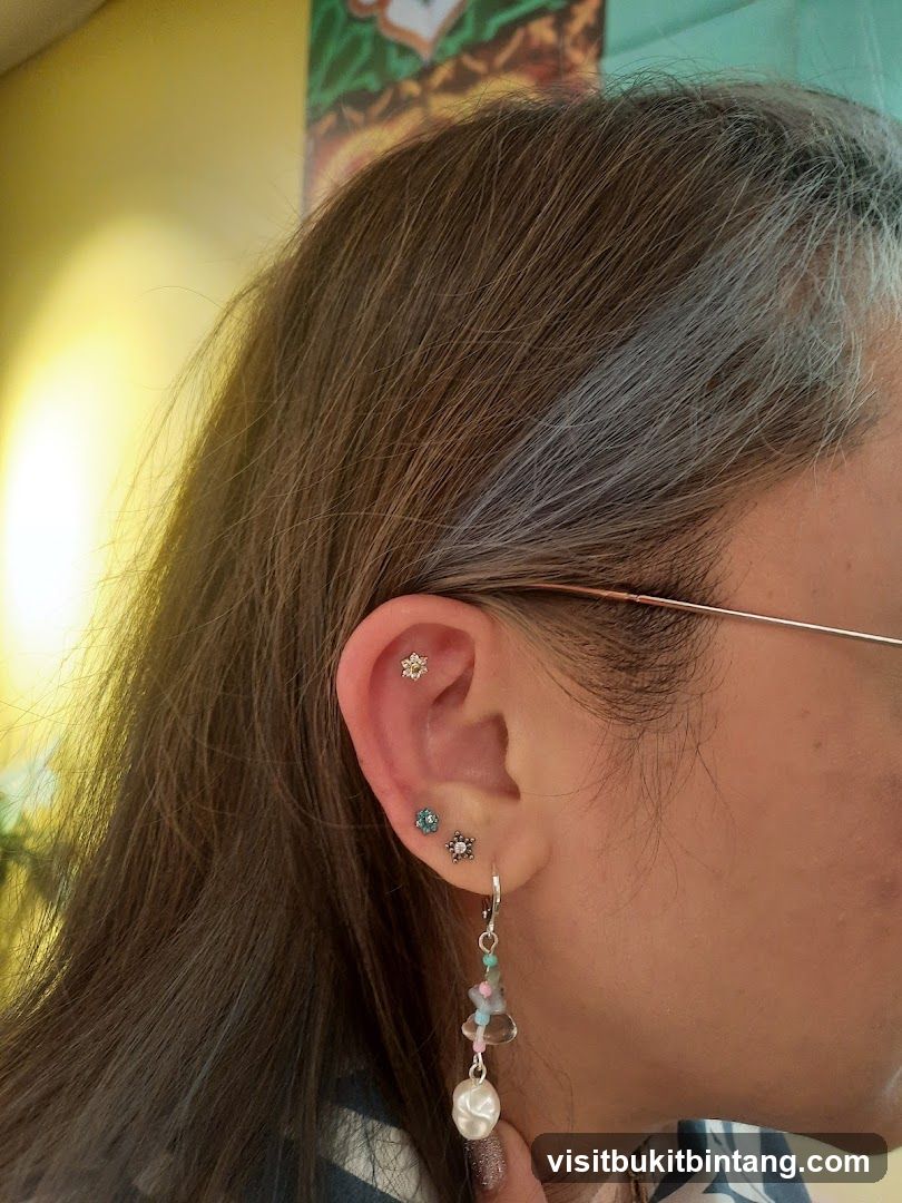 Woman's Ear with Multiple Piercings and Dangling Earring