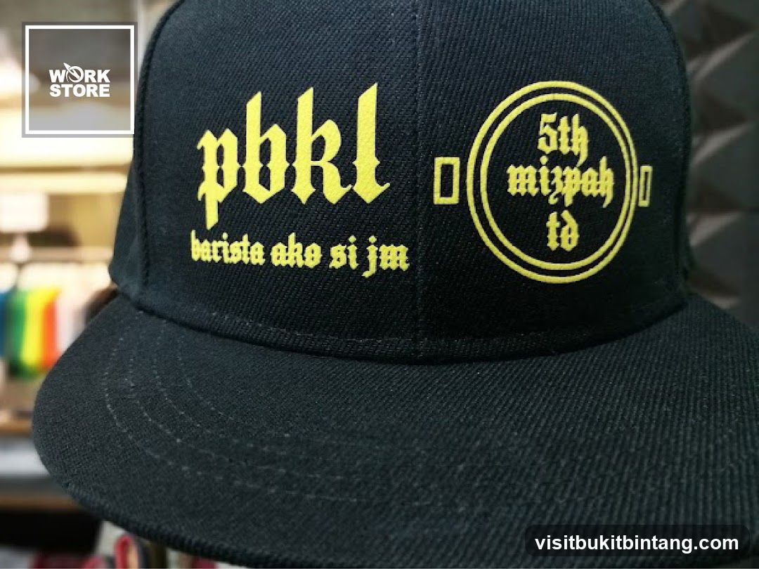 Black baseball cap with yellow text