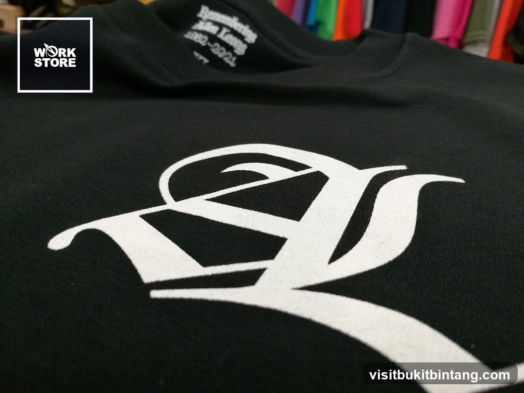 Black T-shirt with white graphic and text