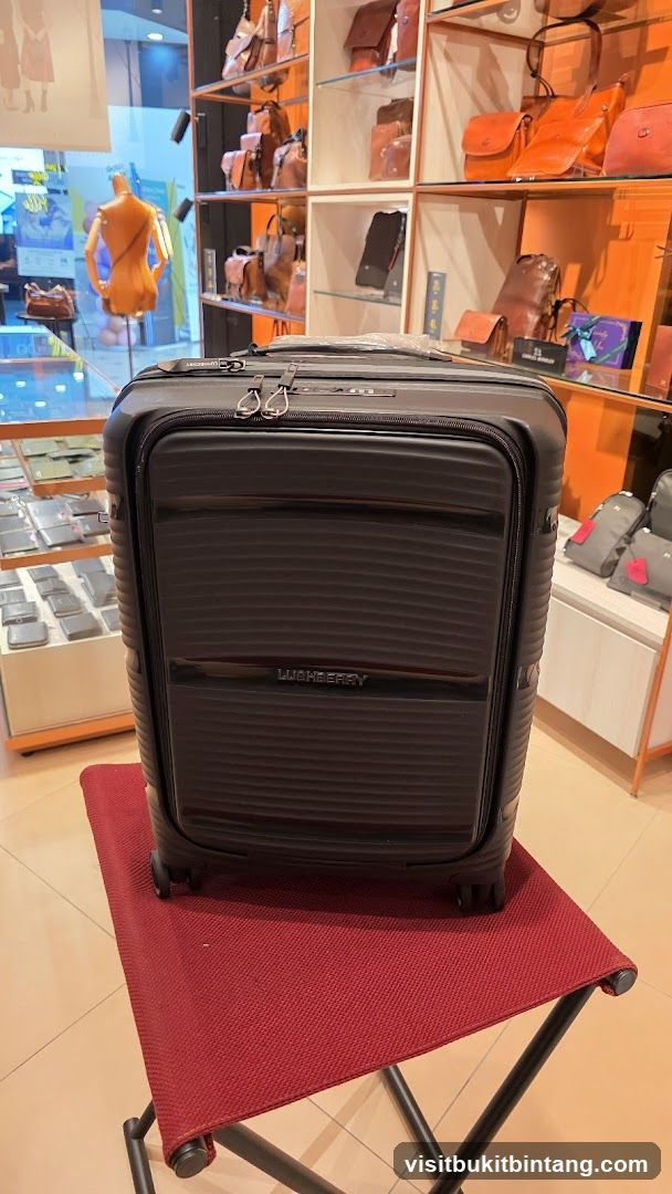 Luggage on a red stool in a store