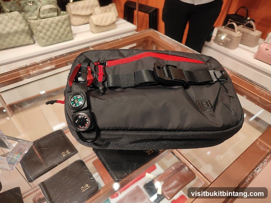 Black waist bag with compasses