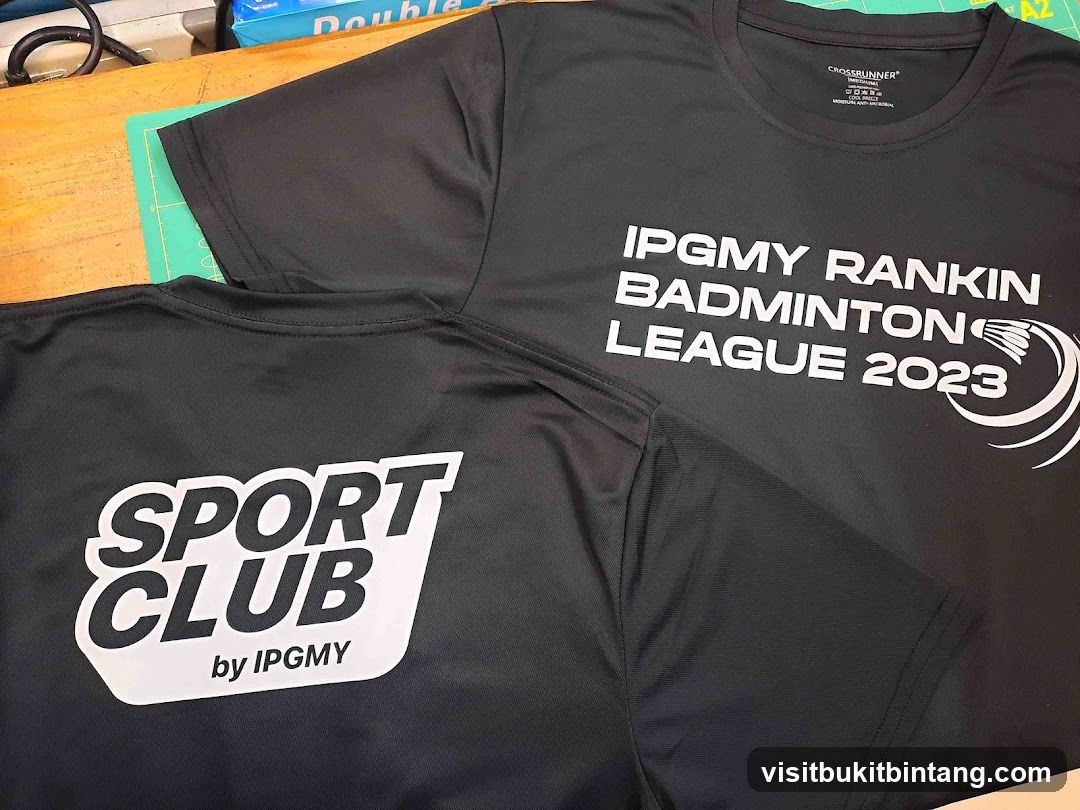 Black T-shirts with white text and logos