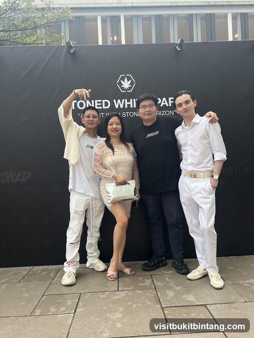 Group Posing in Front of a Branded Backdrop