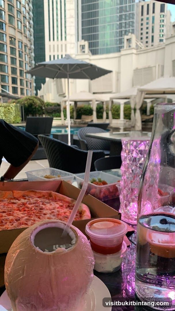 Outdoor Dining with Pizza and Coconut Drink