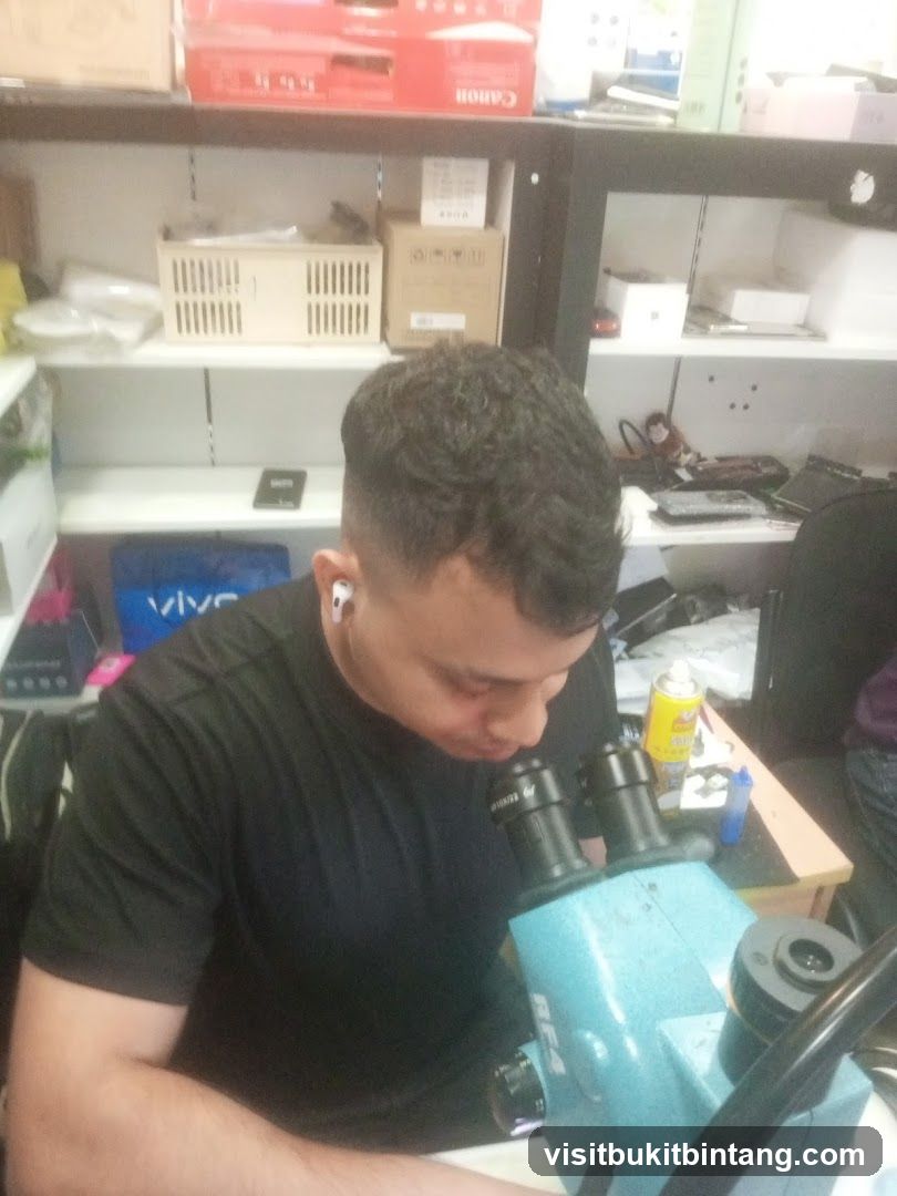 Man working with a microscope