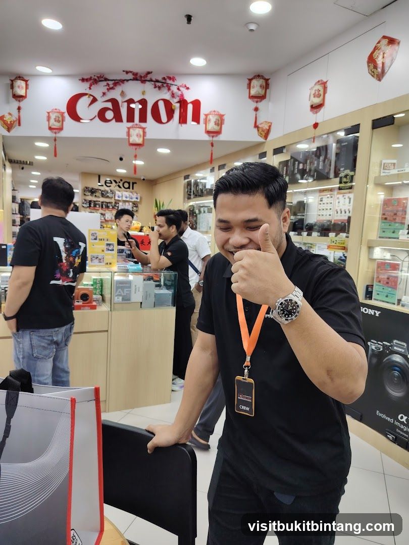Man giving a thumbs up in a camera store