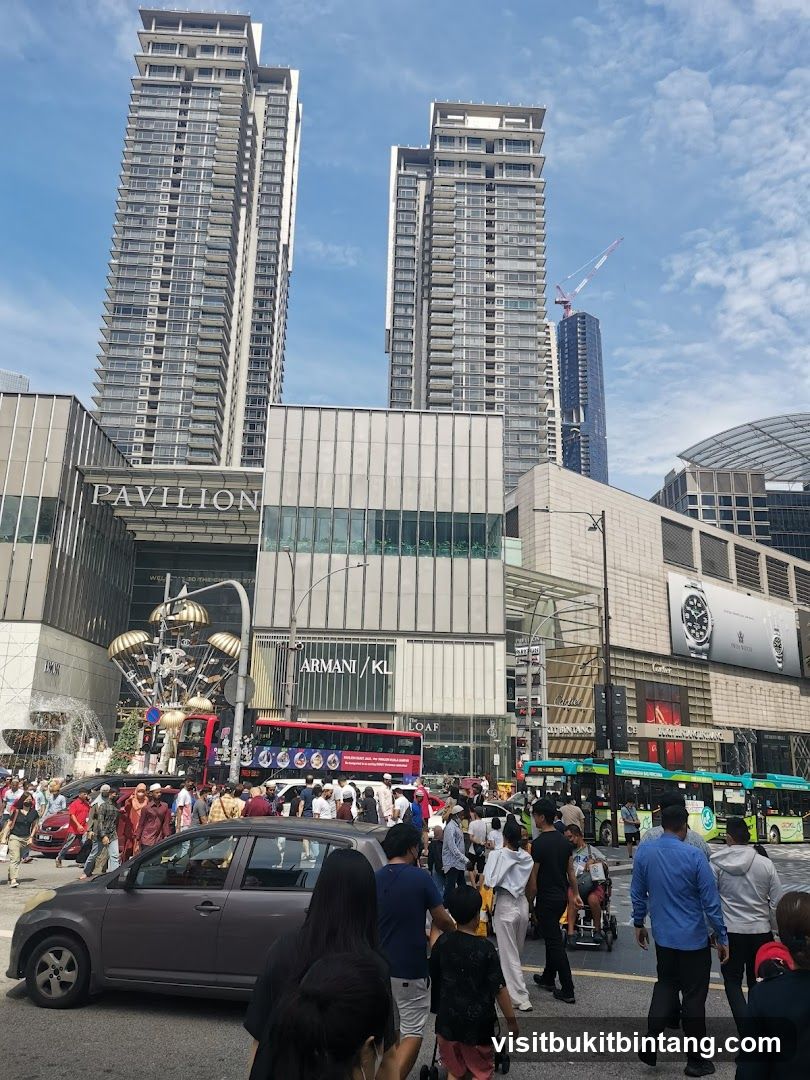Busy street scene with tall buildings and shops