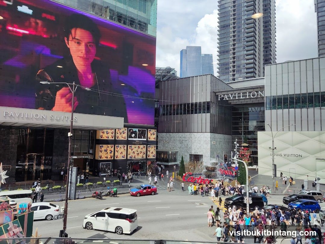 Busy City Street with Large Digital Billboard and Shopping Center