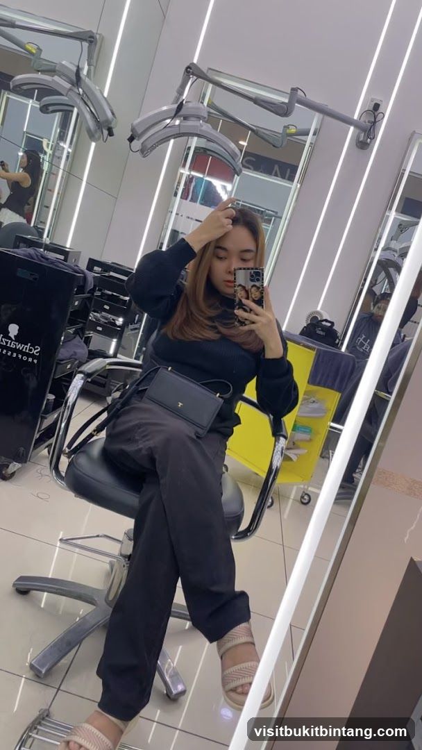 Woman taking a selfie in a salon