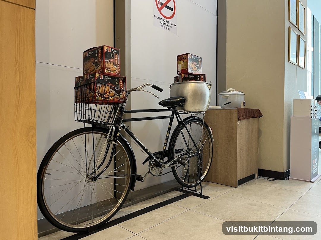 Bicycle with stacked boxes and cooking pots