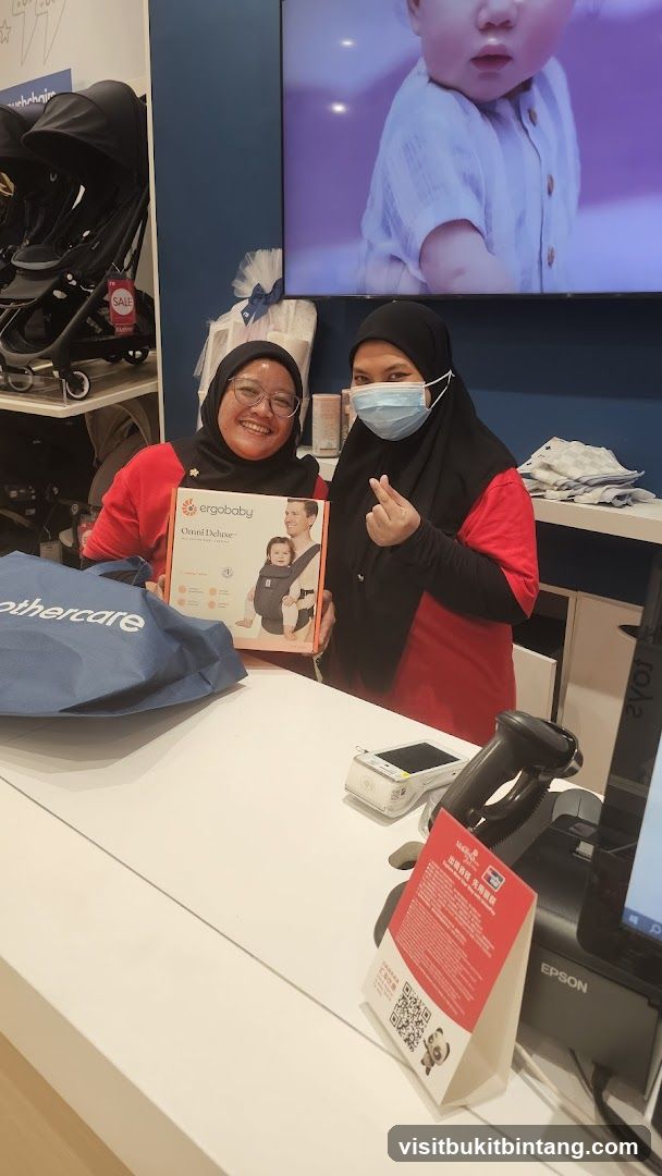 Store Employees with Baby Carrier