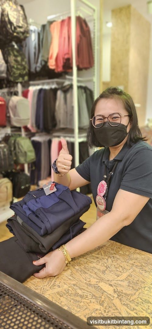 Store employee with folded pants