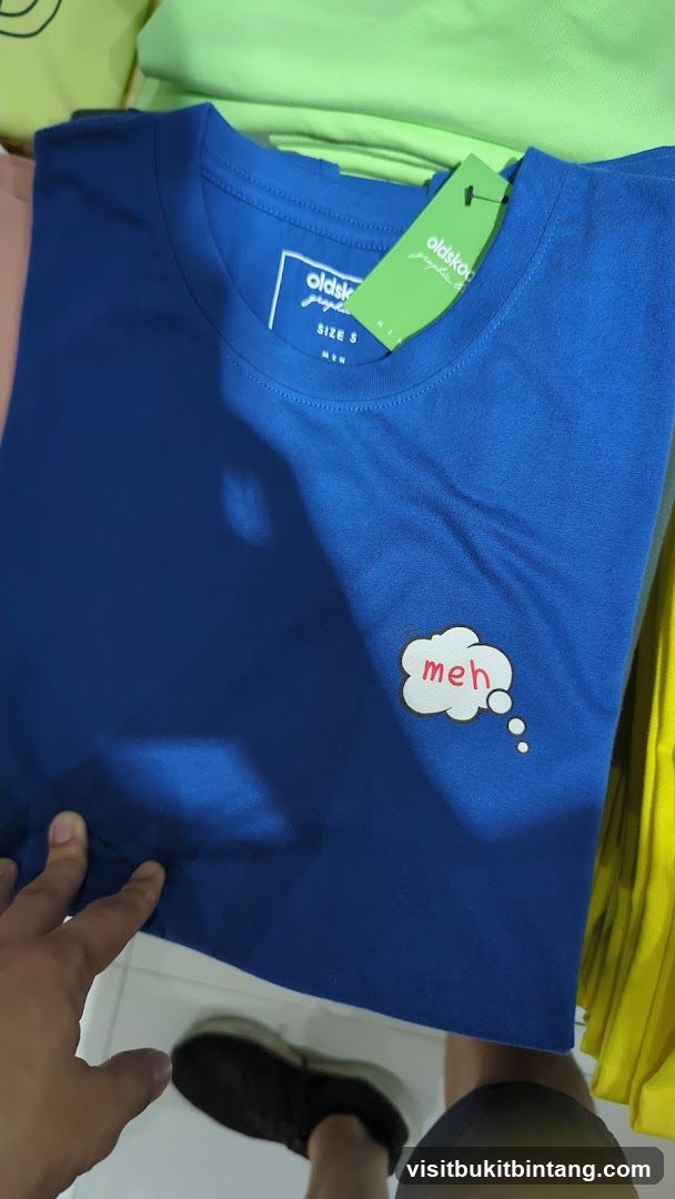 Blue T-shirt with "Meh" graphic