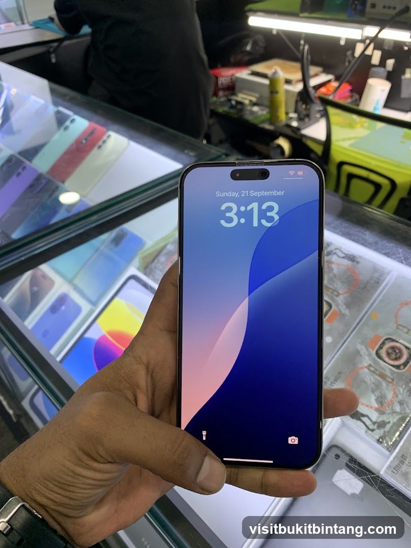 Hand holding a smartphone in a store