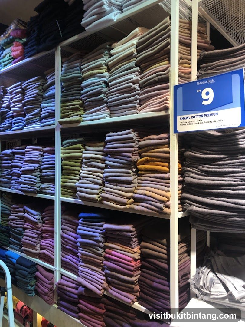 Shelves of Folded Shawls