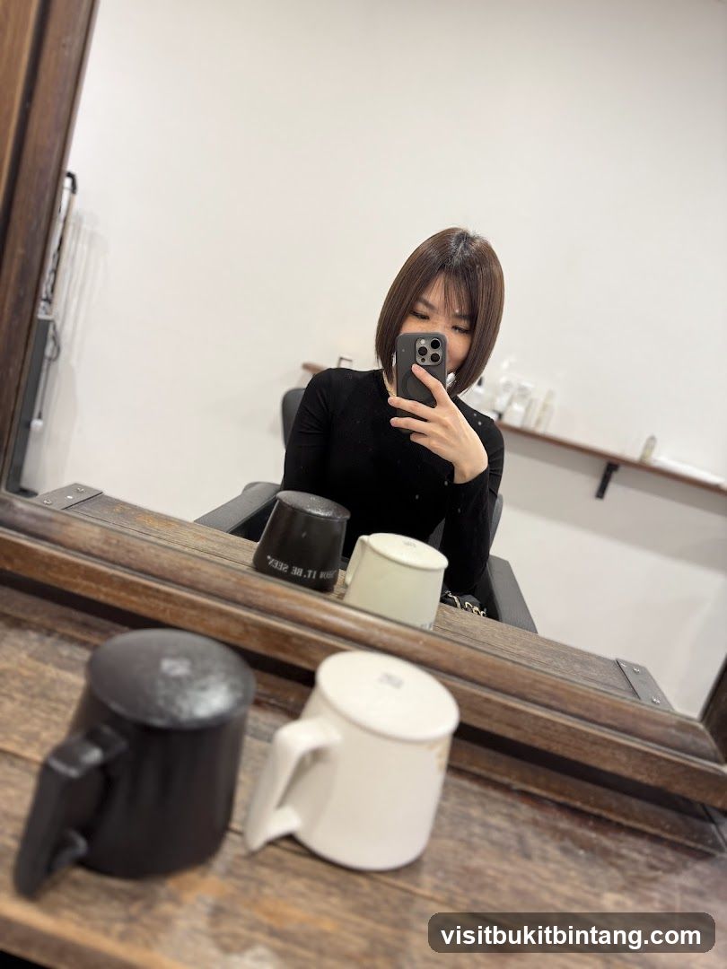 Woman Taking Mirror Selfie in Salon