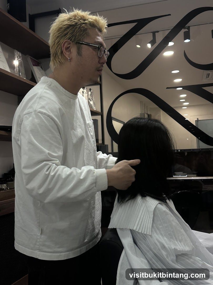 Hairdresser styling client's hair