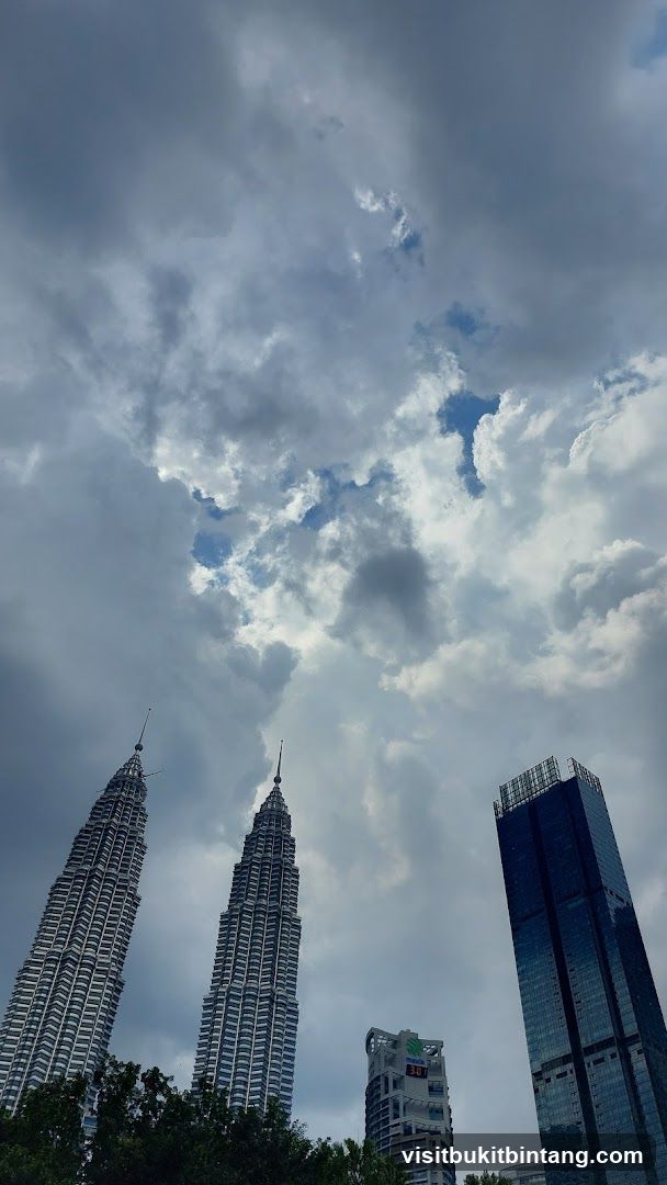 Petronas Towers under cloudy sky