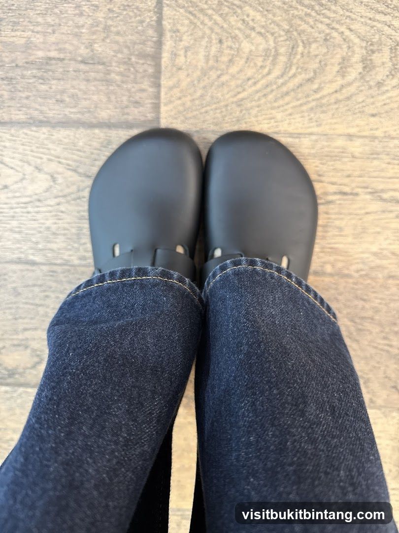 Feet in Dark Shoes and Jeans