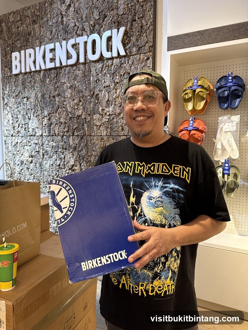 Man holding a Birkenstock box