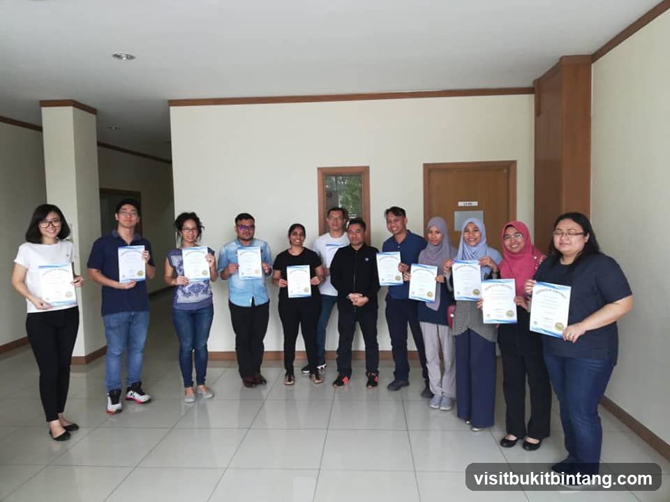Group of people holding certificates