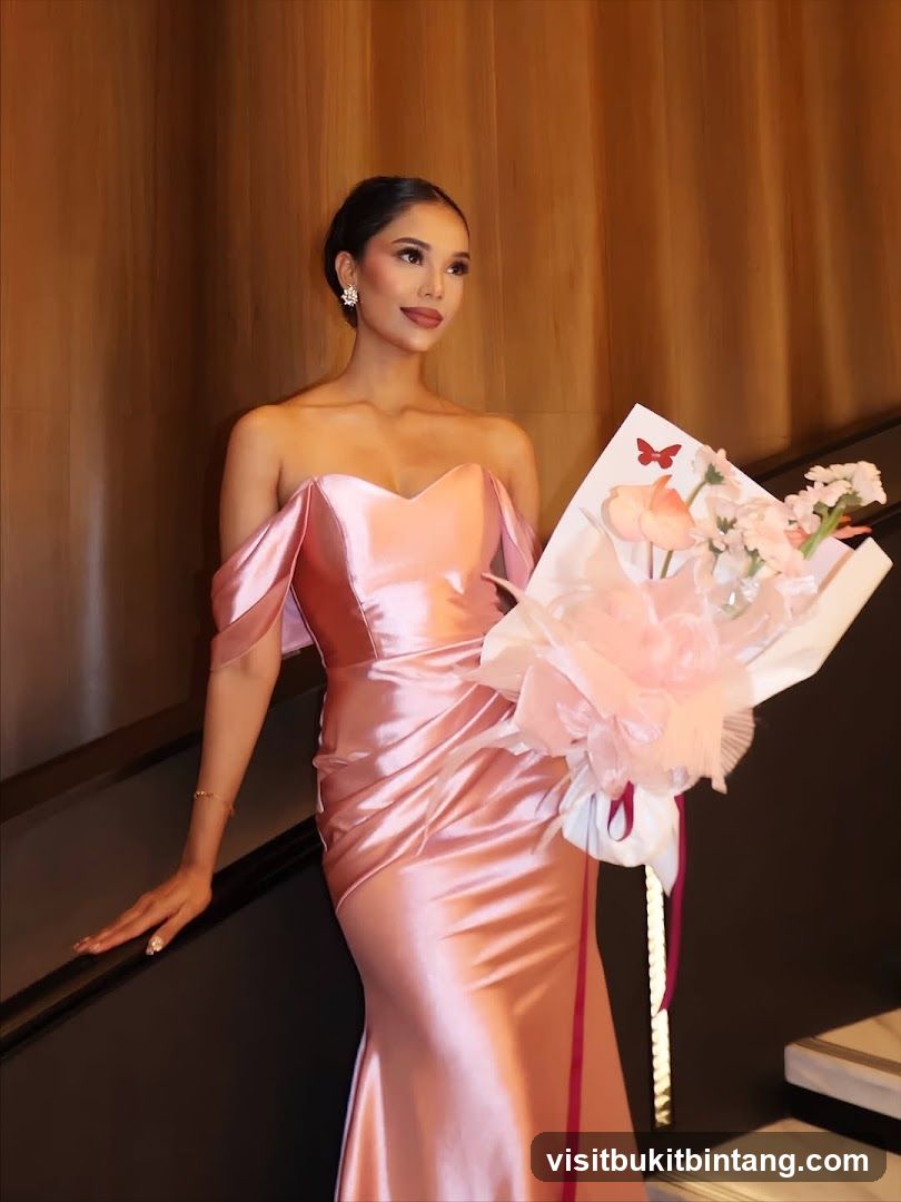 Woman in a pink dress holding a bouquet