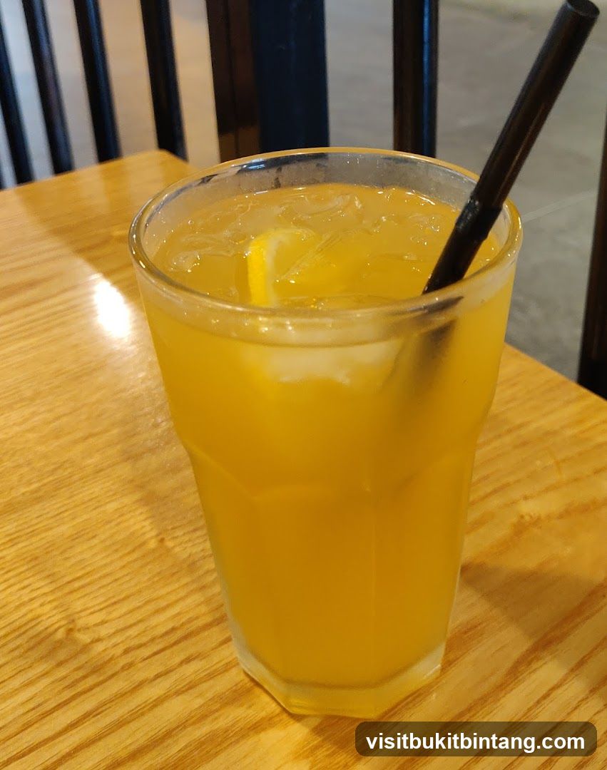 Orange Juice with Lemon and Straw