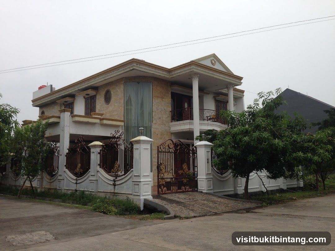Large modern house with ornate gate