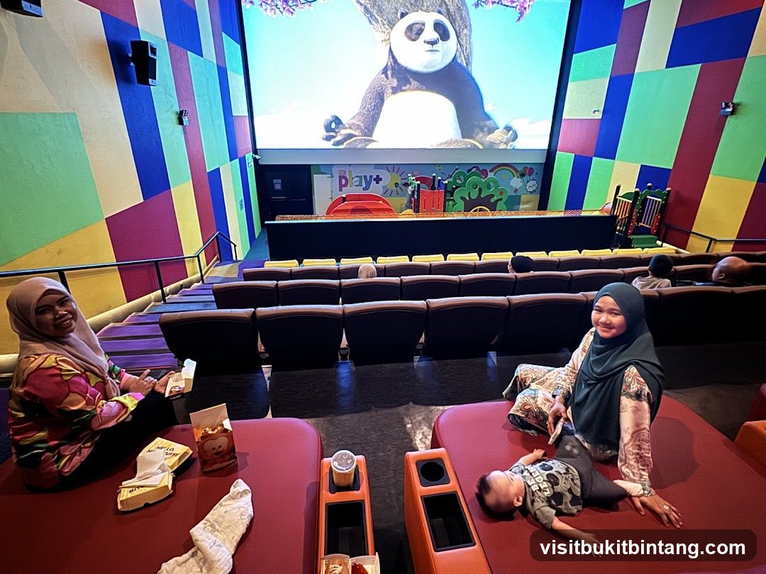 Family watching a movie in a colorful cinema