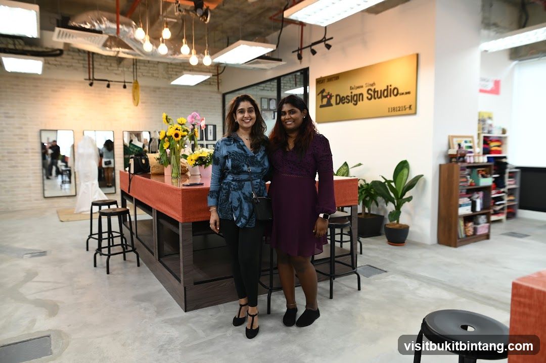 Two women posing in a design studio