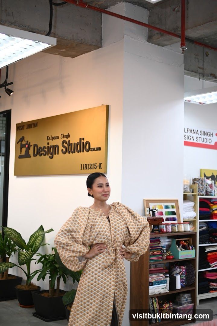 Woman in a patterned dress in a design studio