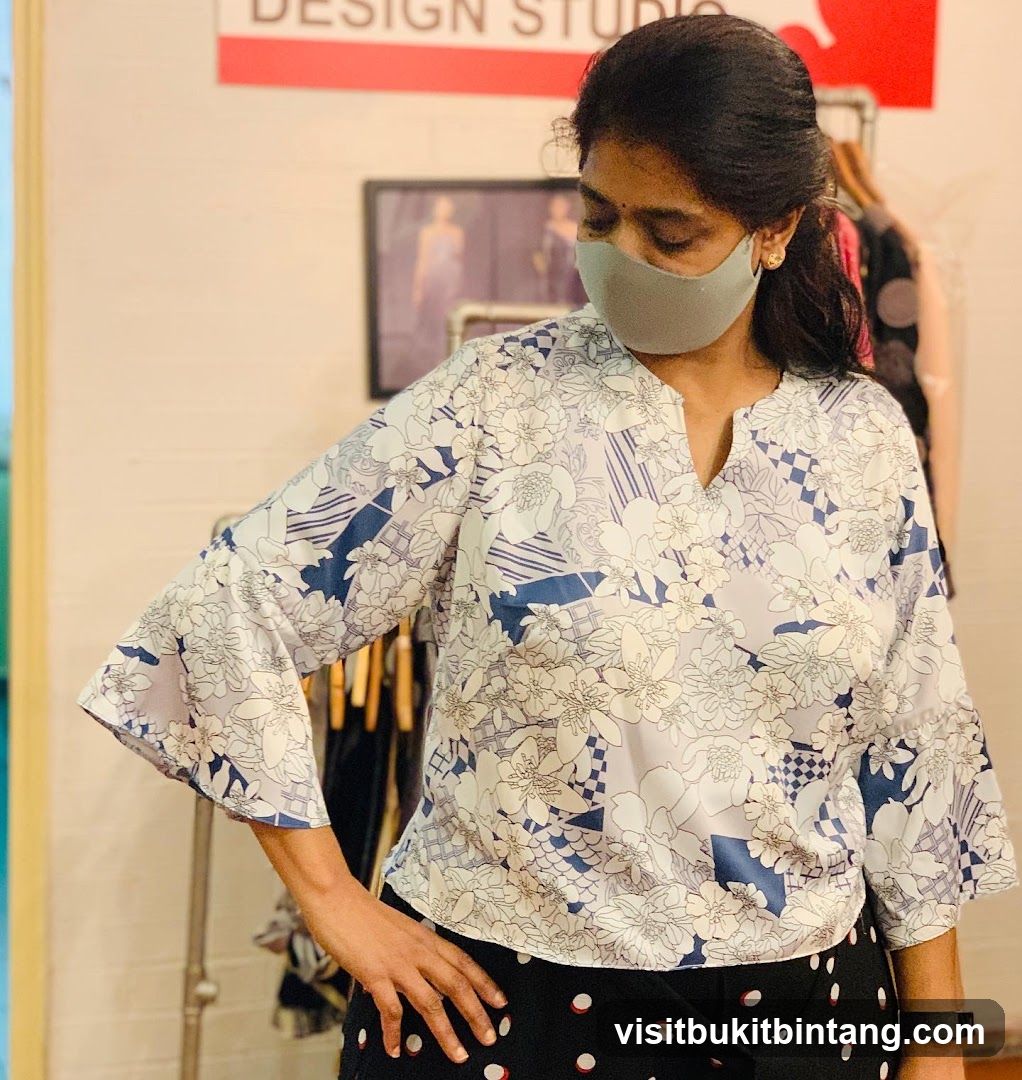 Woman in patterned blouse